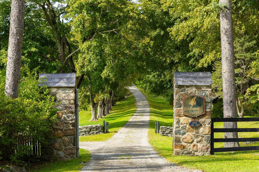 Perched above the rolling hills of Millbrook Hunt Country with sweeping Catskill Mountain views, this idyllic retreat and exceptional equestrian estate spans 185 ultra private acres.