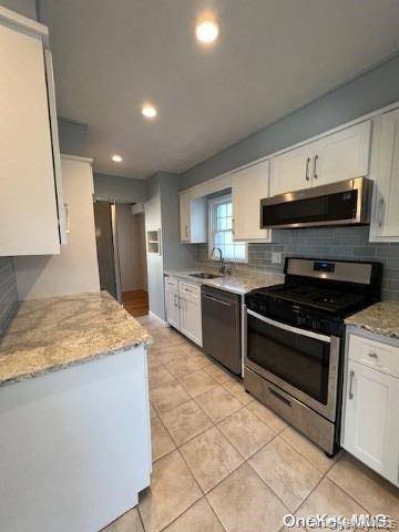 Beautiful Ranch in the Heart of Hicksville, 3 Bed One Bath, finished basement.
