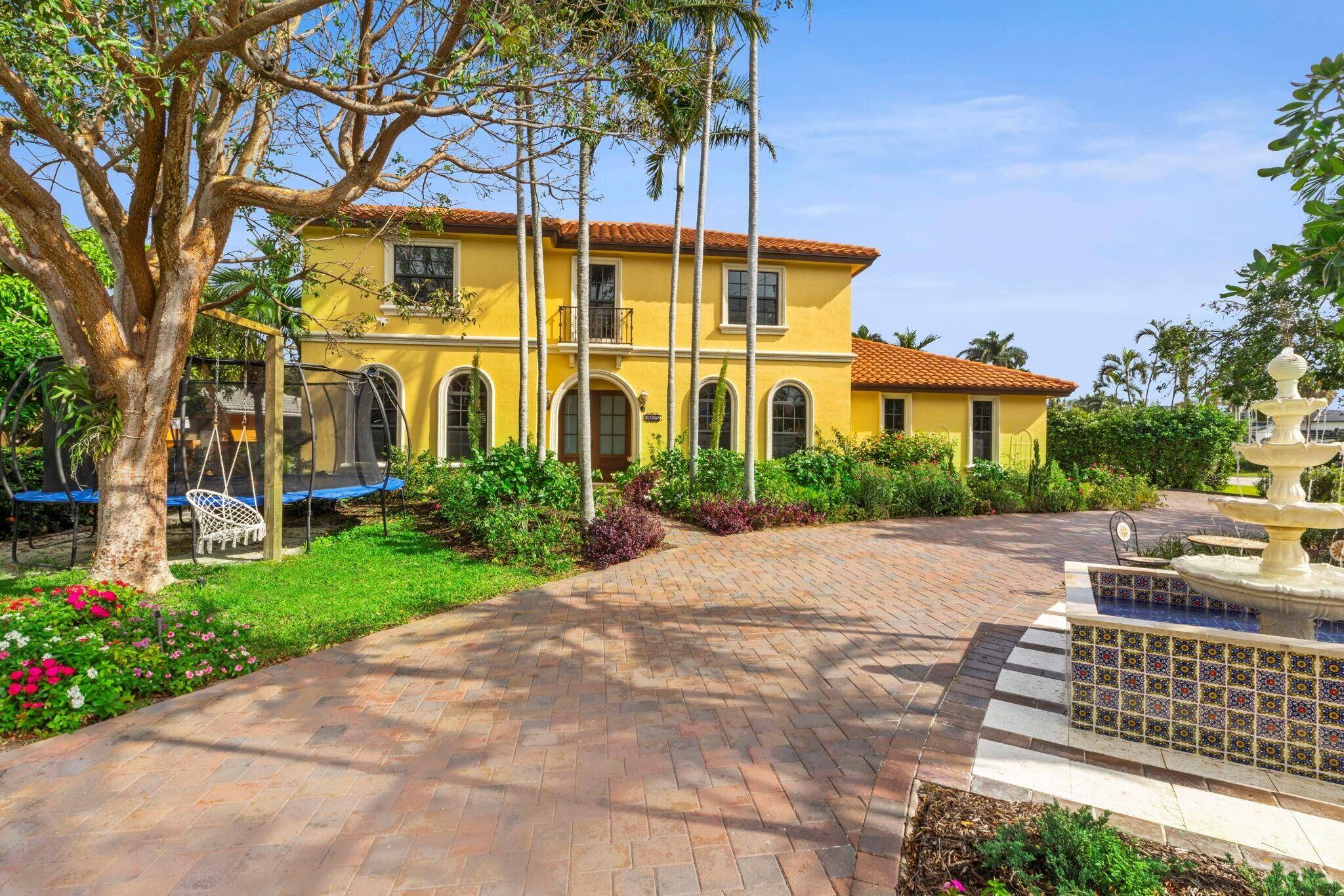 Elegant updated residence, with a spectacular outdoor entertaining backyard, features 50 feet of waterfrontage and a dock along the end of the Abaco canal that connects to the Intracoastal.