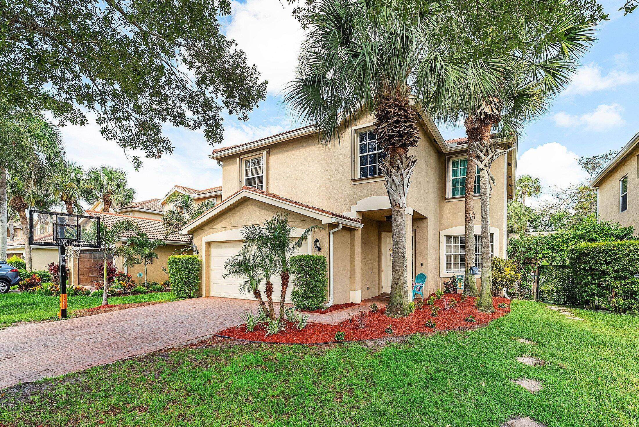 Spacious 5BD 4BA home in the gated community of Greystone in Boynton Beach.