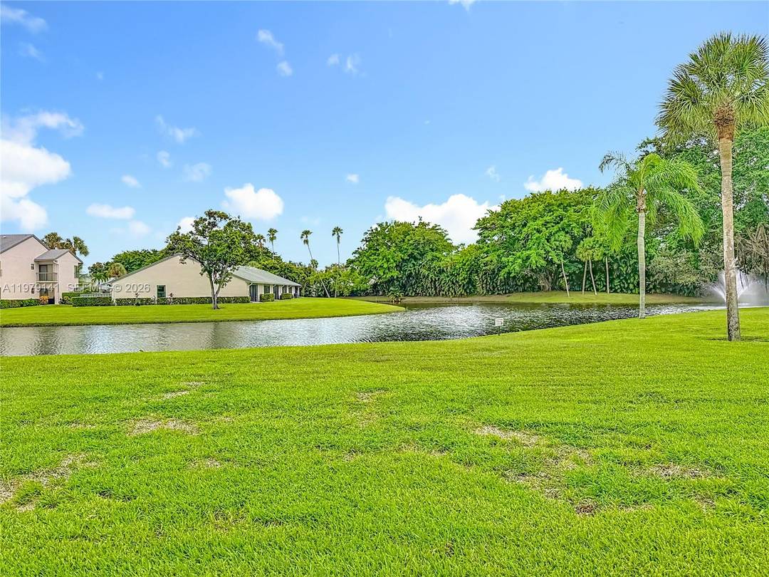 Enjoy beautiful lake views from every room in this 2 bedroom, 2 bathroom Boca Glades home featuring tile floors in the main living areas, wood floors in the bedrooms, granite ...