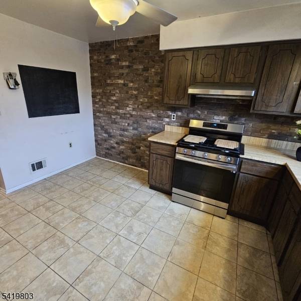 Welcome to this desirable end unit townhouse in Tudor Village offering space, privacy, and a layout designed for comfortable living.