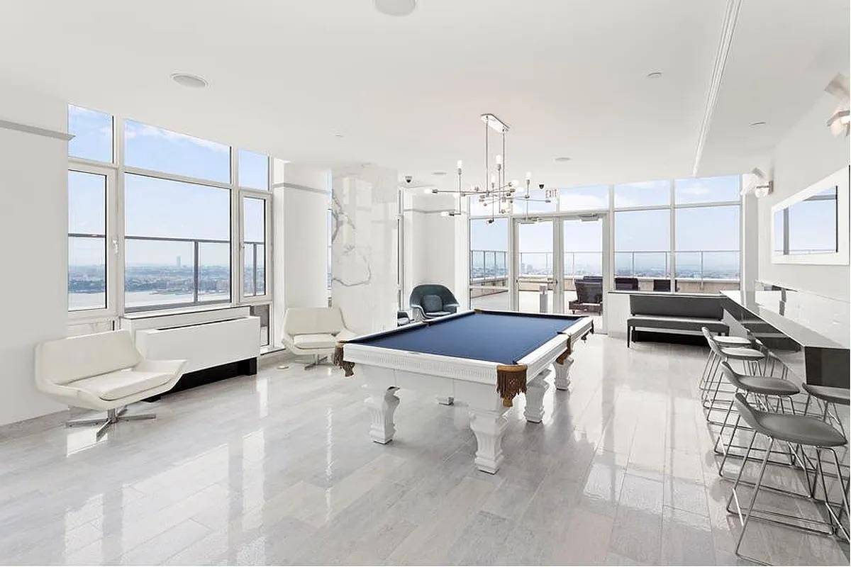 Welcome to this modern north facing two bedroom, two bathroom residence at The Atelier, offering panoramic views of the Hudson River and Billionaires Row.