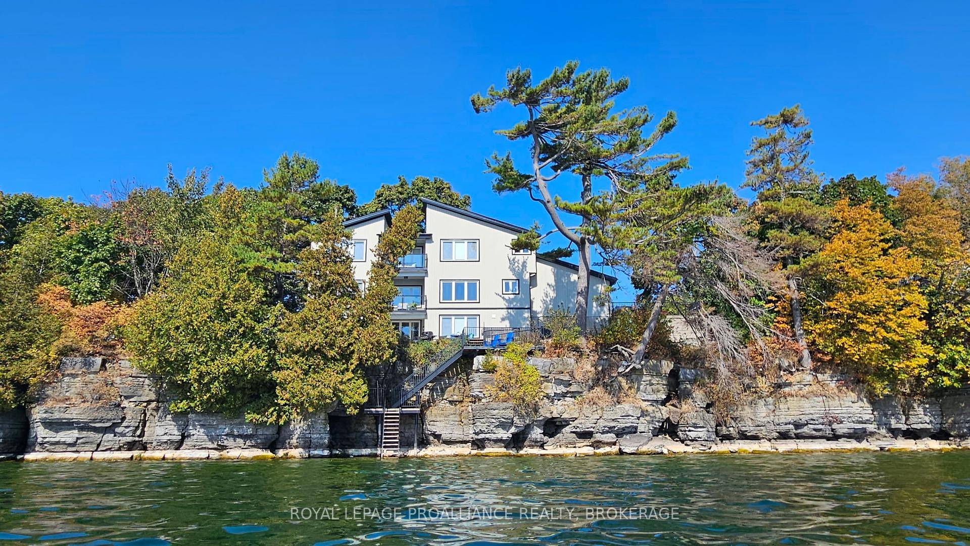 Welcome to your dream home on the shores of Lake Ontario where stunning design meets serene natural beauty.