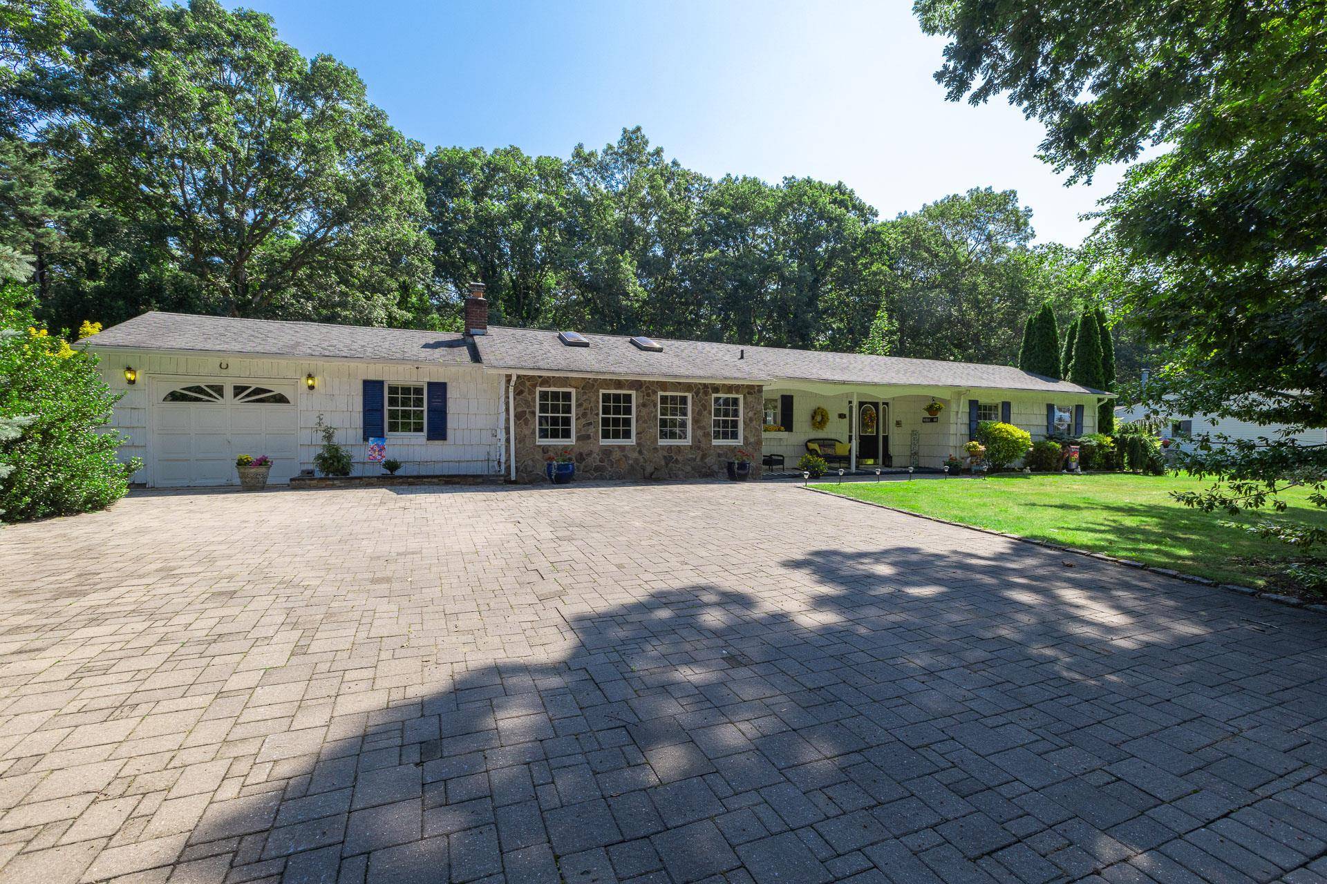 Welcome to this spacious and thoughtfully designed 3 bedroom expanded ranch home, perfectly situated on a quiet cul de sac in the desirable Shoreham Wading River School District.