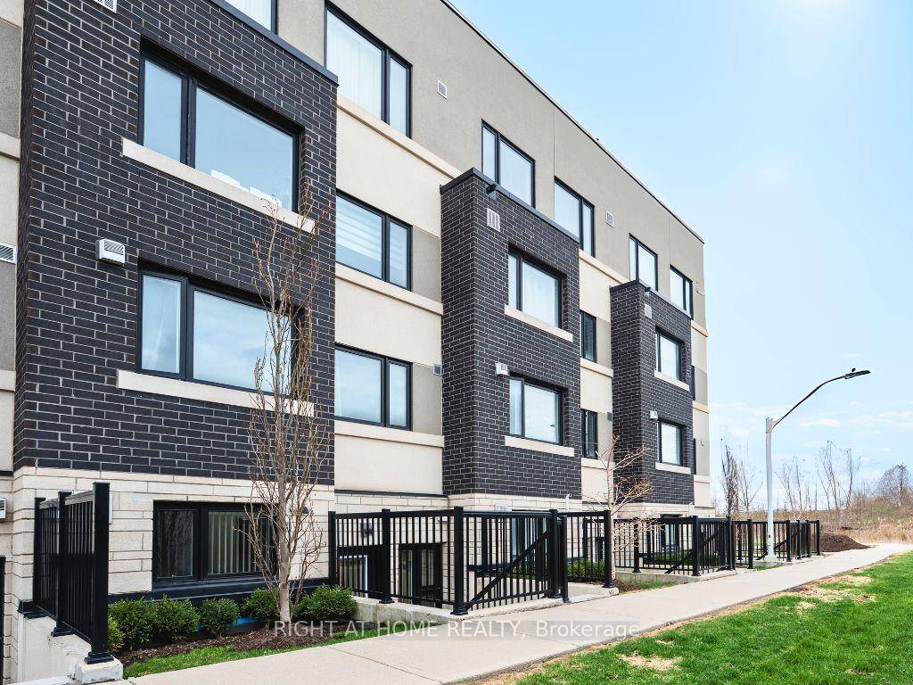 Modern one bedroom stacked townhome in Burlington featuring premium finishes, an open concept layout, and an unbeatable location.