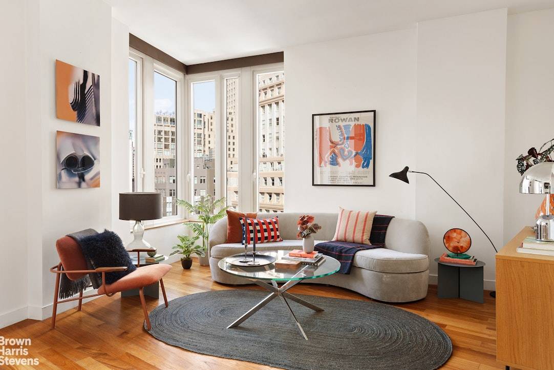 Welcome to Residence 33I at 15 William Street a sunny 2 bedroom, 2 bathroom apartment perched high above the Financial District featuring open city views and a sleek modern design.
