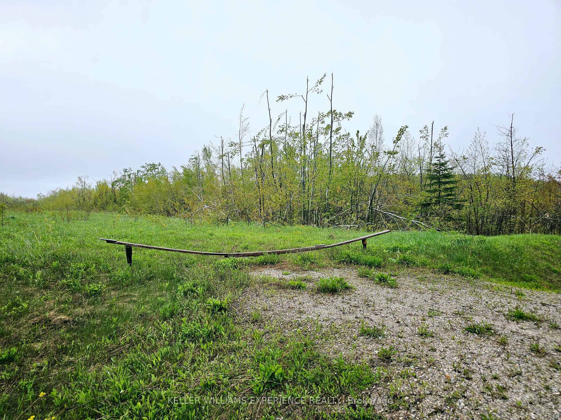 Welcome to an exceptional opportunity to create your dream home on over 7 acres of beautifully treed land, ideally located just outside the charming town of Meaford.