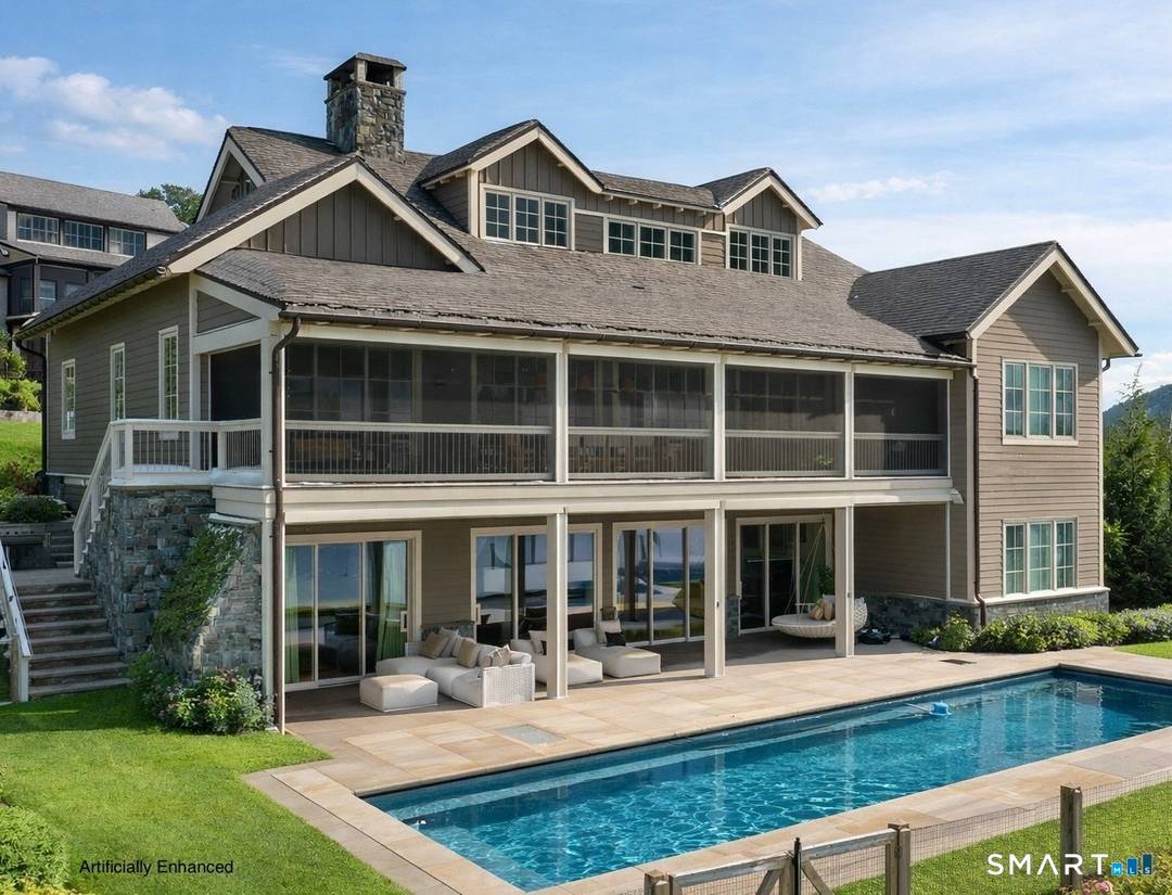 Refined Luxury. Rare Direct Lakefront Home within the Coveted Silo Ridge Community.