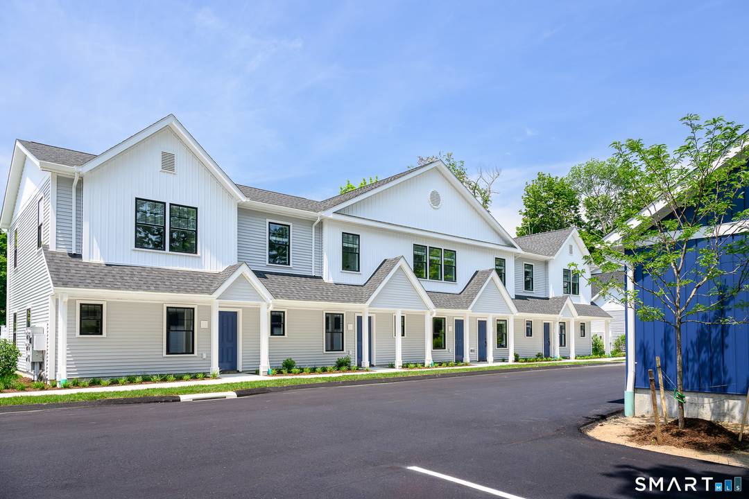 Rare end unit with a first floor primary bedroom in East Lyme's newest 55 community.