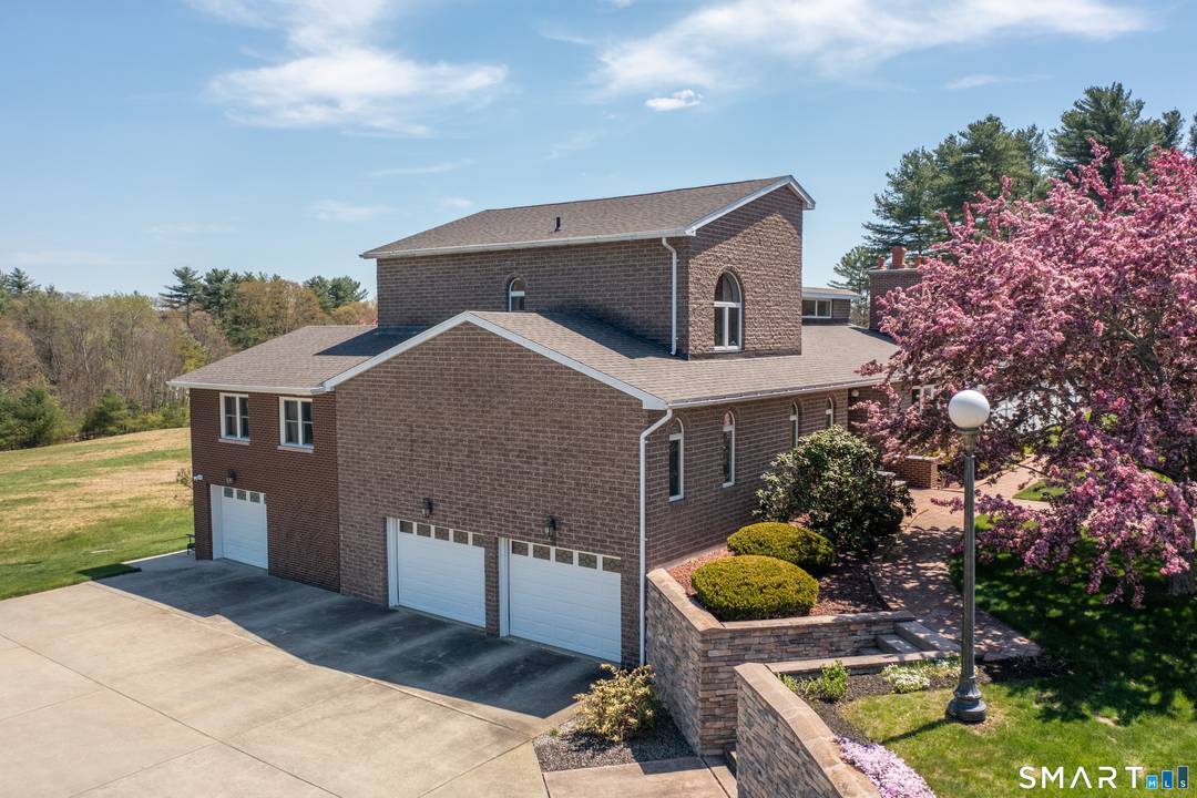Welcome to this exceptional, custom built brick home, set on a stunning piece of property where quality, craftsmanship, and timeless design come together beautifully.
