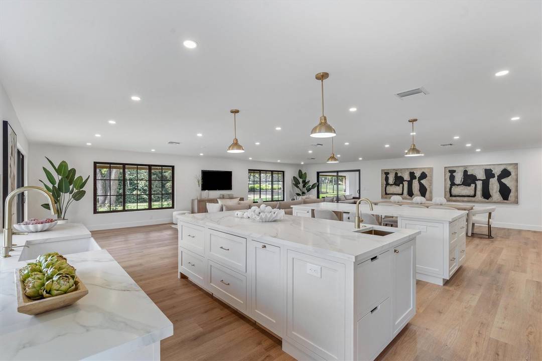 Exquisitely renovated Modern Tudor on a lush 1 2 acre golf front lot in the heart of PBG.