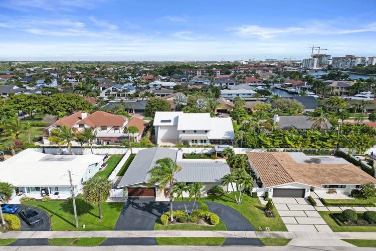 Nestled on a quiet street across from multi million dollar homes and just moments from the Intracoastal estates of Lighthouse Point, this Ruttenberg style home offers 4 bedrooms, 3 baths, ...