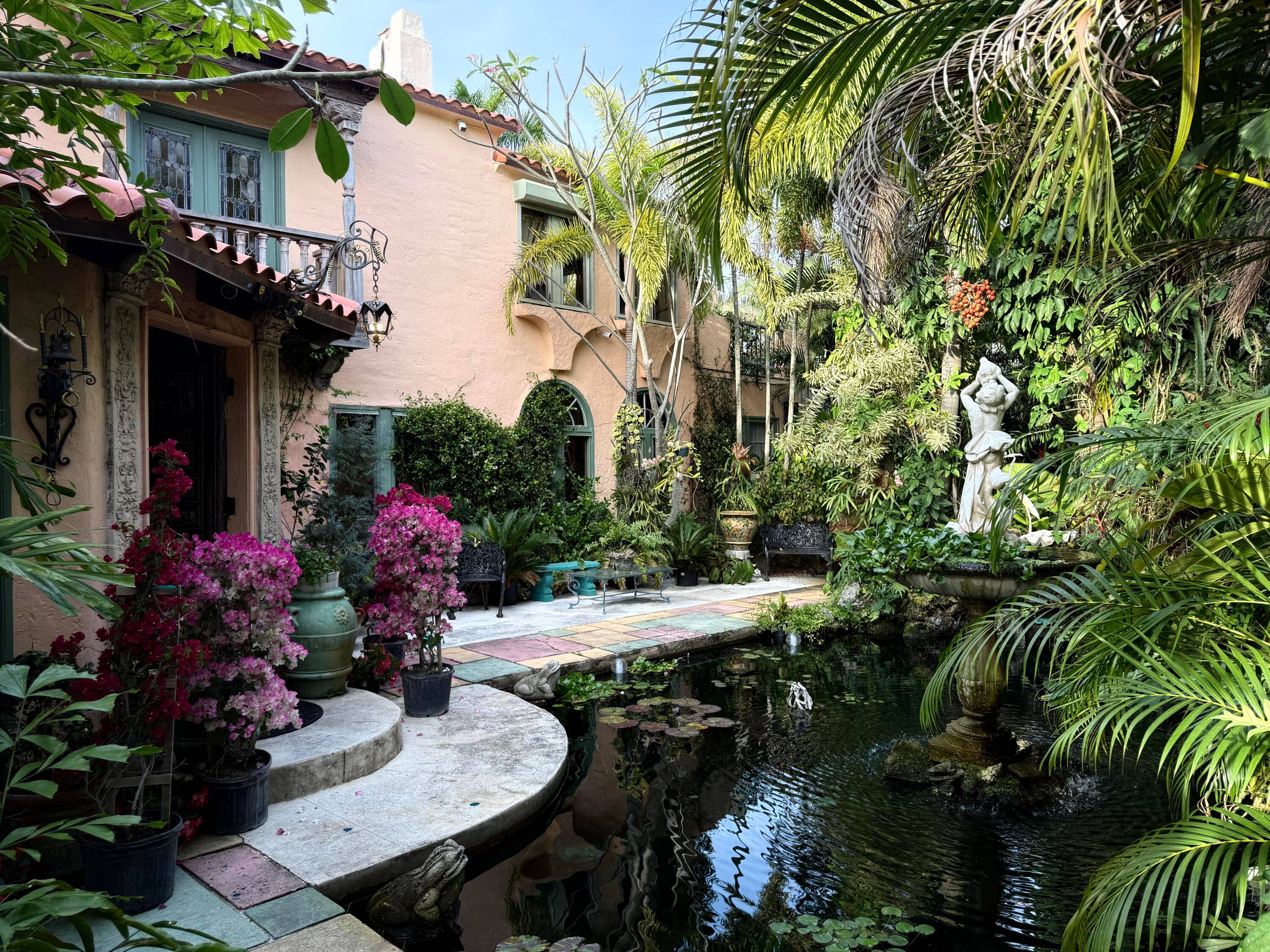 George and Ernestine Bensel commissioned this Spanish Colonial Masterpiece in 1925 with pecky cypress balconies, arcaded porches, fountains and walkways that adorn the grand interior spaces.