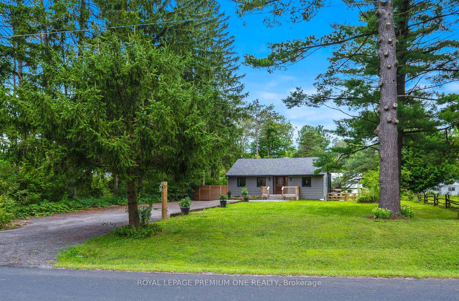 Charming bungalow extensively renovated from top to bottom in quiet rural Stouffville setting.