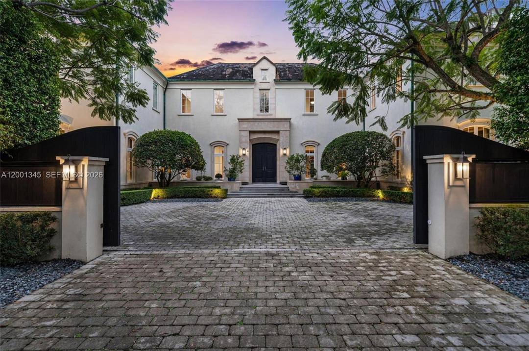 Located on one of North Pinecrest s most coveted and private streets, 9741 W Suburban Dr is an owner built residence inspired by timeless cha teau style architecture.