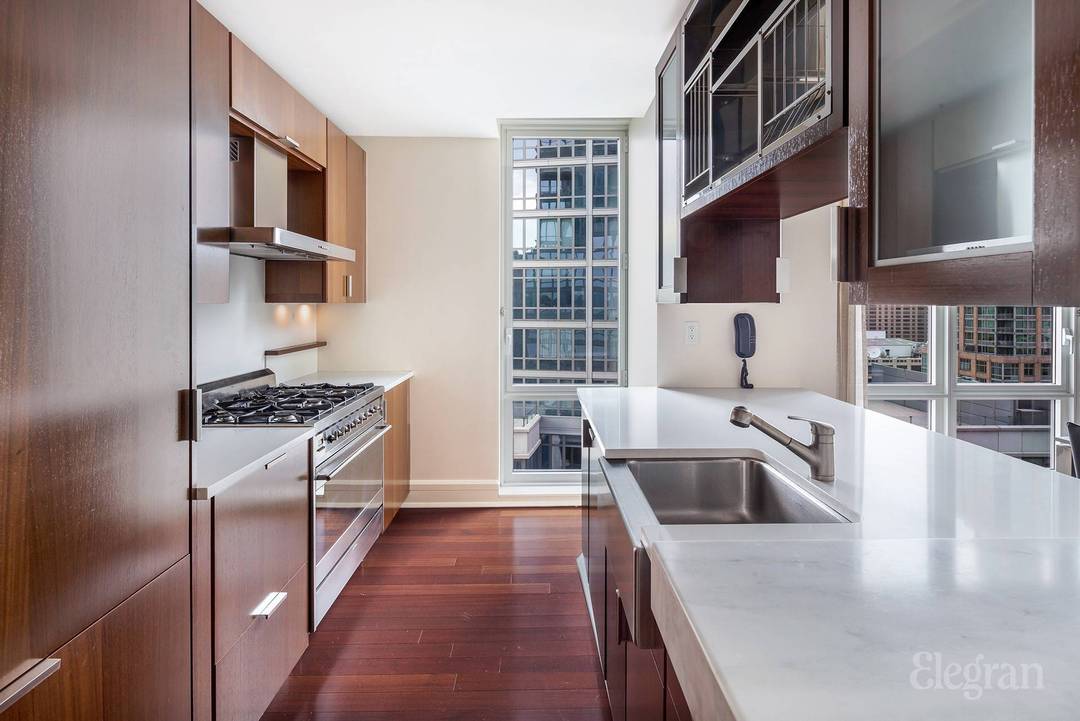 Spacious and pristine corner two bedroom condo with sweeping river views is now available at The Aldyn in Lincoln Square !