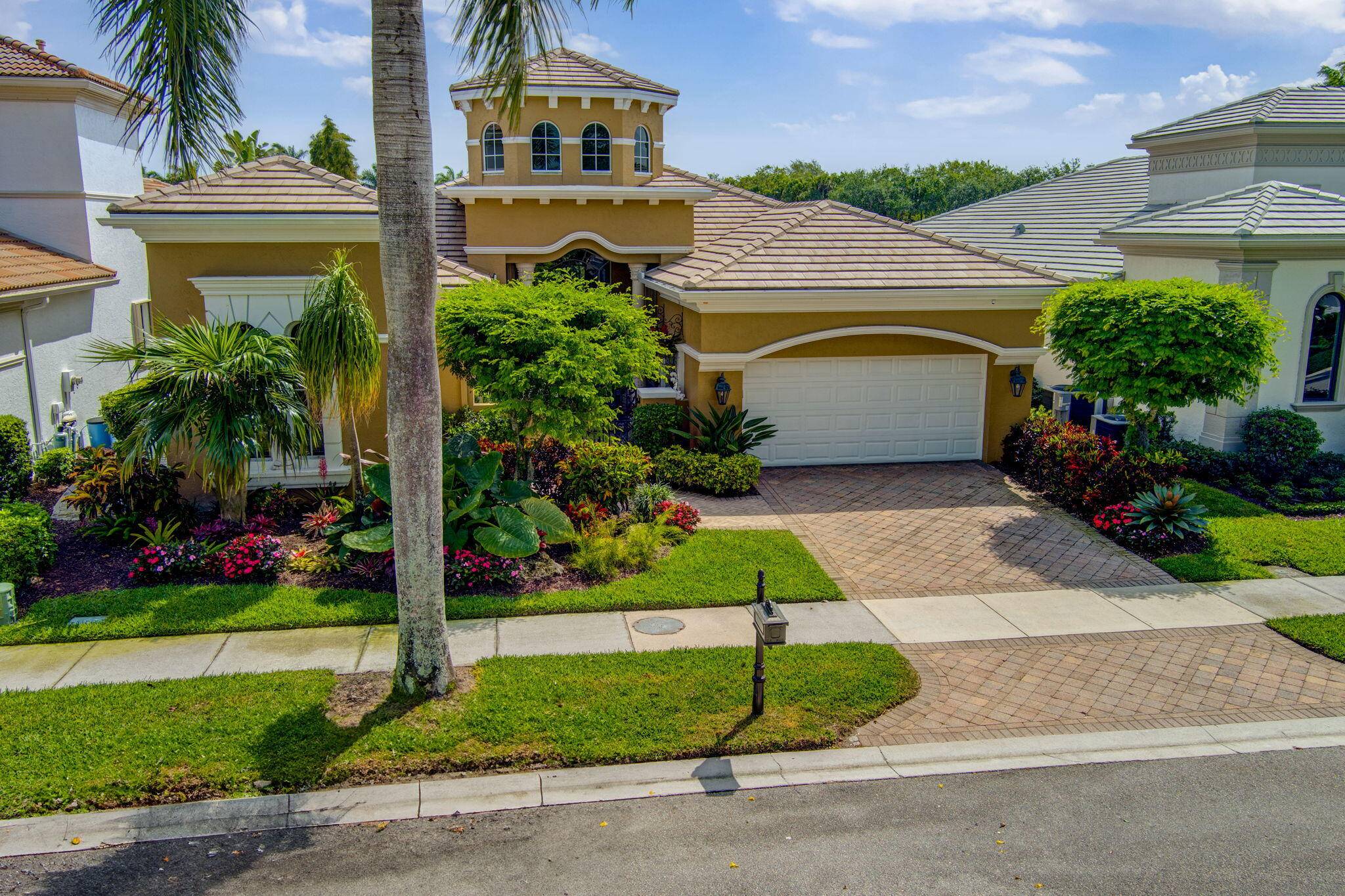 Located in the prestigious Country Club at Mirasol, this impeccably updated home boasts the finest finishes and a spacious layout.