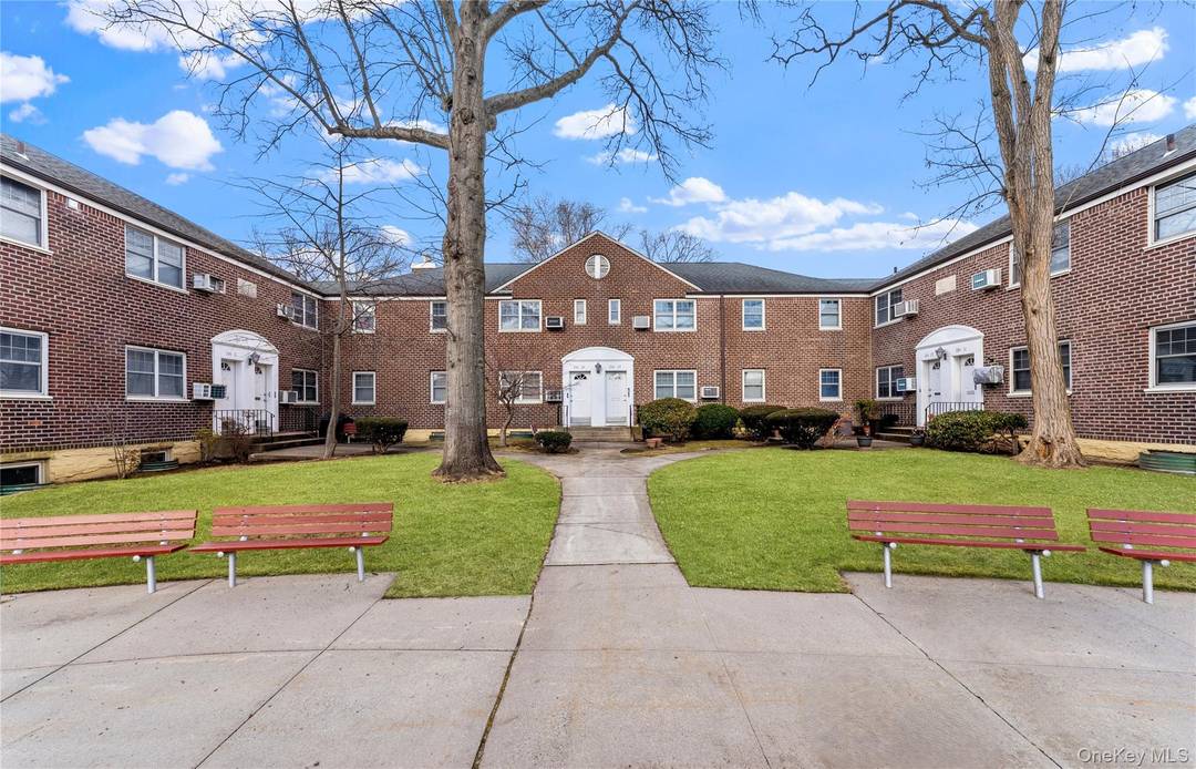 Rare True 3 Bedroom Lower Corner Unit with Separate Dining Room Located in a Beautiful Tree Lined Courtyard.