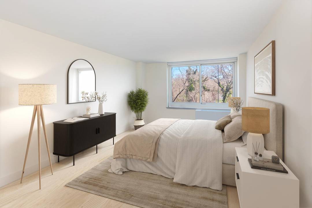 NOTHING SHORT OF PHENOMENAL A wall of windows spanning the living and dining room magnificently frames the unobstructed views of the Hudson River, the Palisades and beyond.