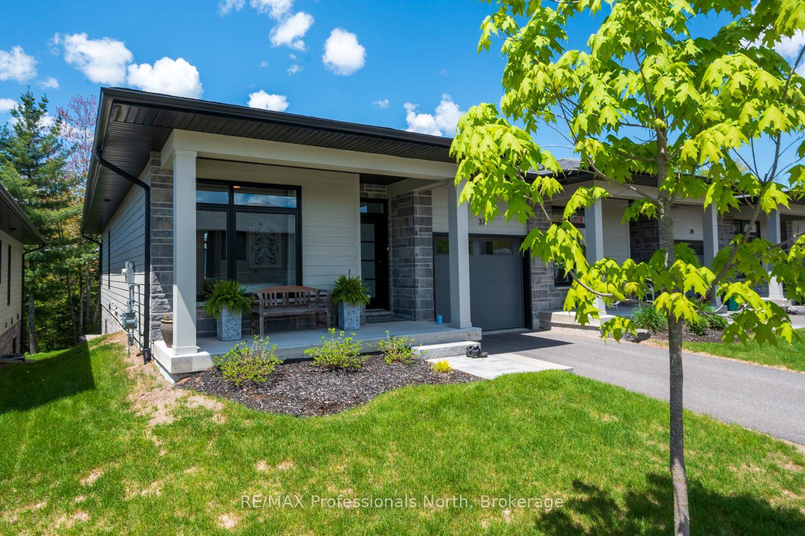This beautifully designed end unit condo in the Highcrest Homes development offers the perfect blend of modern comfort and natural serenity.