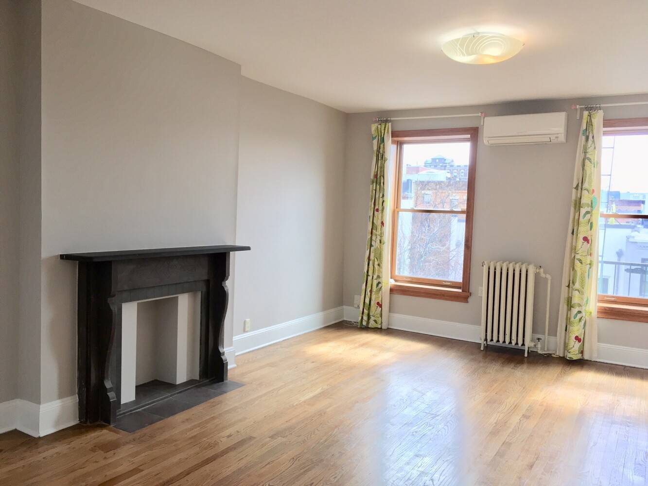 Three bedroom and one bath top floor apartment with skylights and in unit washer and dryer.