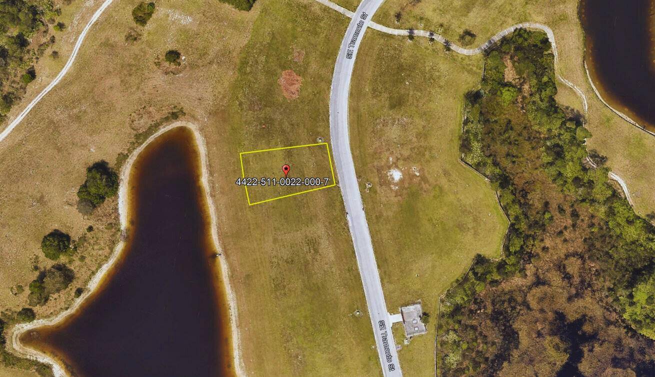 Nestled within the prestigious gated golf club community of Tesoro Club, this vacant lot presents a rare opportunity to build a custom estate in Port St.