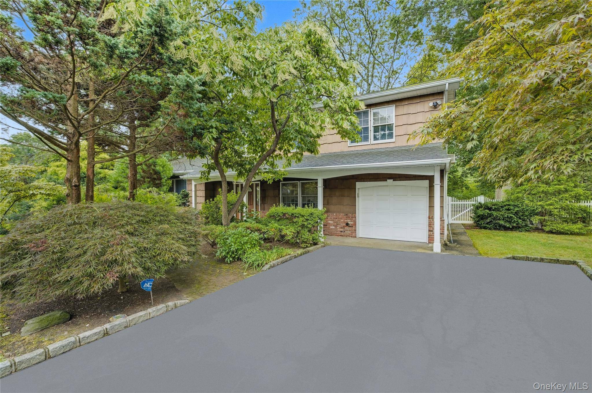 Welcome to 16 Delmar Lane, a beautiful Colonial in the famed Candy Section, set on a generous half acre property.