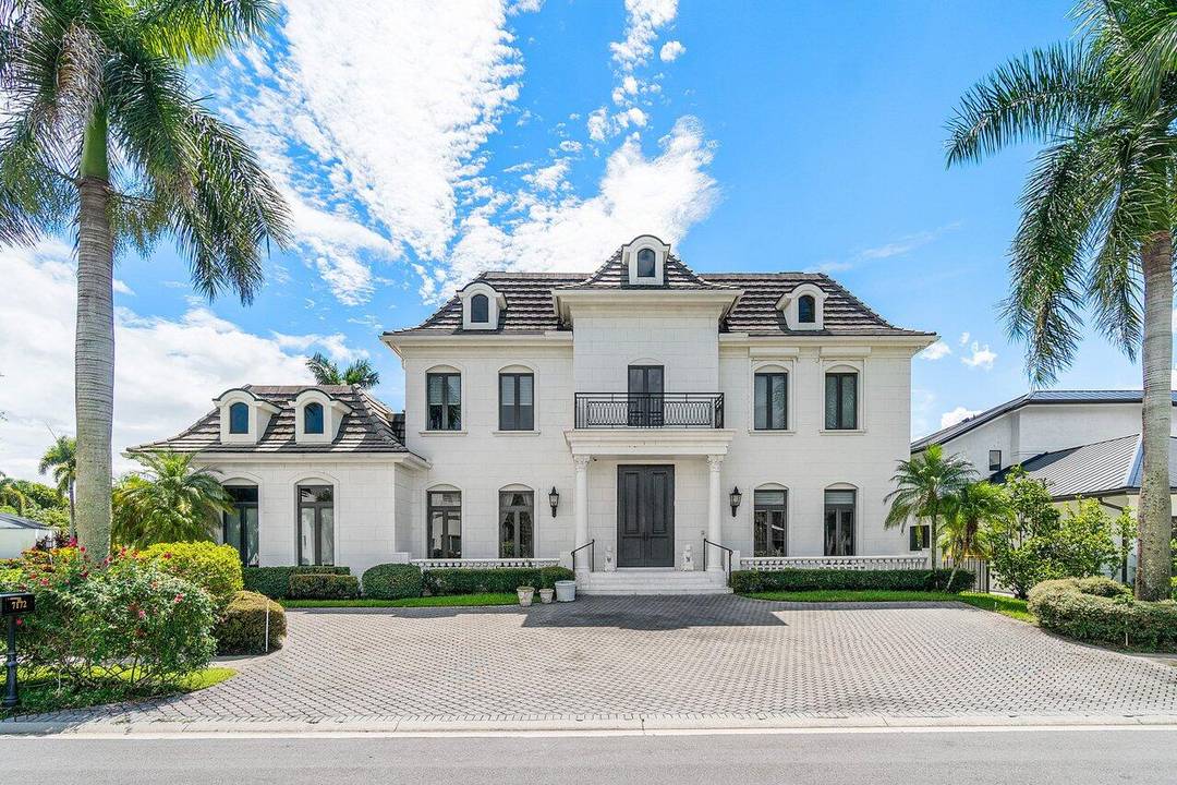 Experience unparalleled luxury in this extraordinary custom European estate, ideally situated within the highly sought after Boca Grove Country Club.
