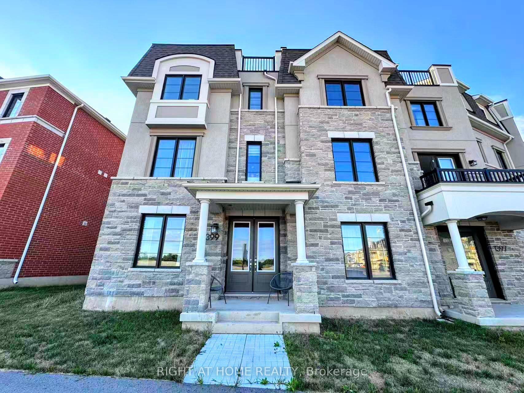 Beautiful 1 year new corner lot townhouse with double garage and 5 spacious bedrooms, offering 2, 333 sq ft of living space.