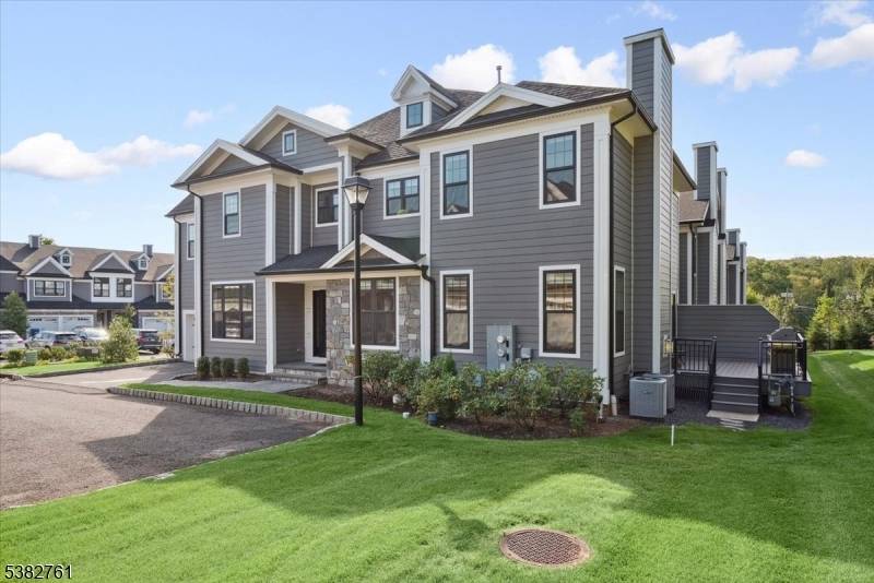 Location ! Modern end unit townhouse situated at the end of a cul de sac with a tree line view off the back deck.