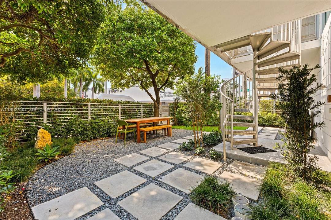 Rare South Beach loft with a large private garden, designed for seamless indoor outdoor living.