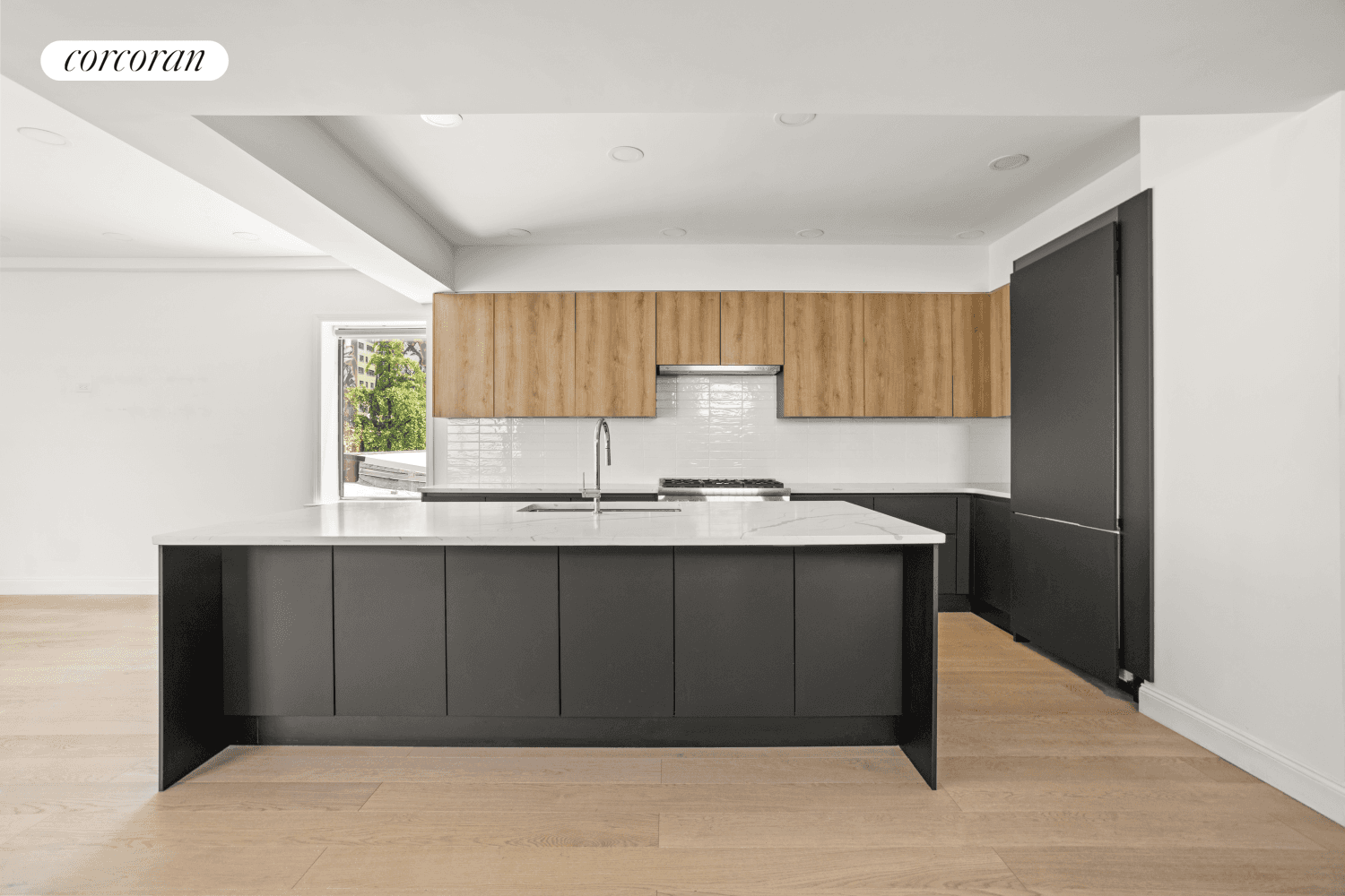 Welcome home to the Triplex at 5 30 51st Avenue, a beautifully reimagined townhouse residence situated on a picturesque tree lined street in Hunters Point.