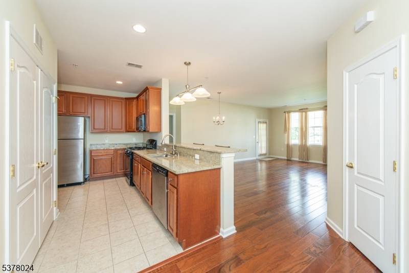 Welcome to this desirable first floor, one level condo in The Grande, featuring 2 bedrooms, 2 full bathrooms, and a private 1 car garage.