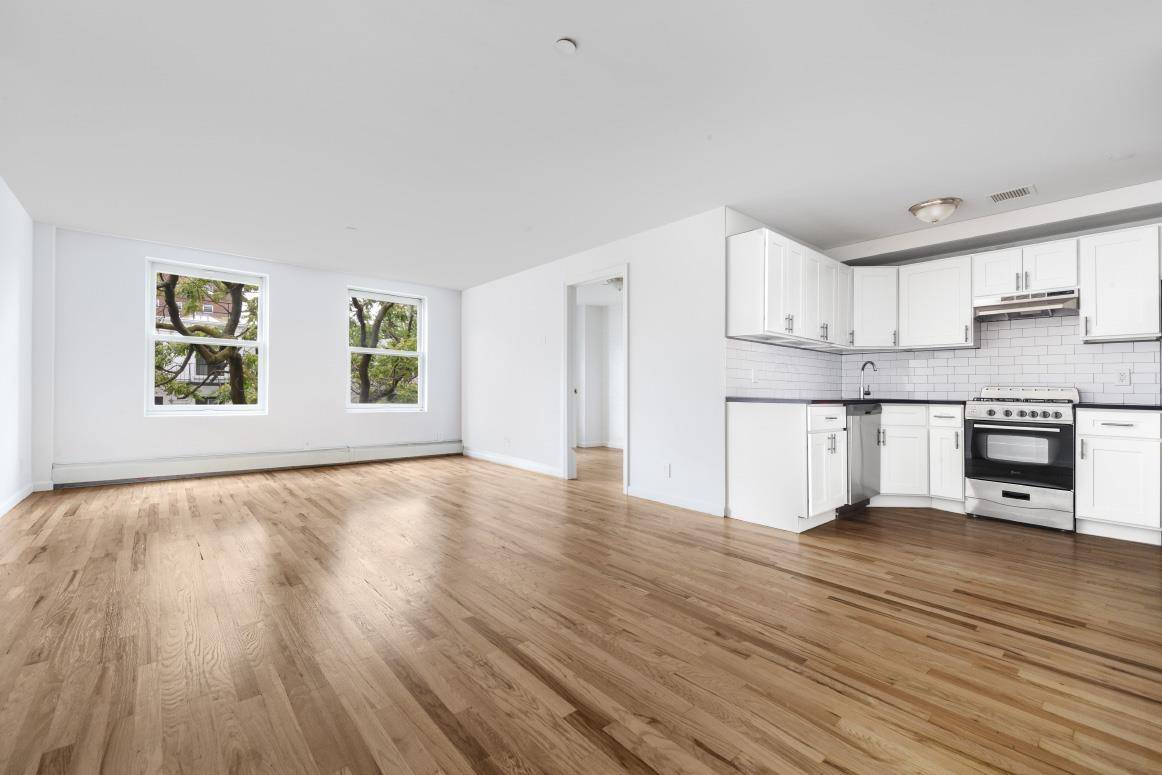 Sprawling two bedroom in an over sized, half floor townhouse facing south with great light.