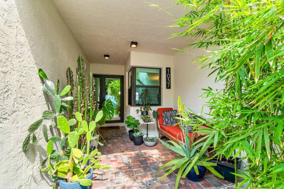 Welcome to 1037 Boca Cove Lane in Highland Beach a beautifully situated waterfront townhome offering Intracoastal views, a dedicated boat dock, and private beach access within a gated, resort style ...