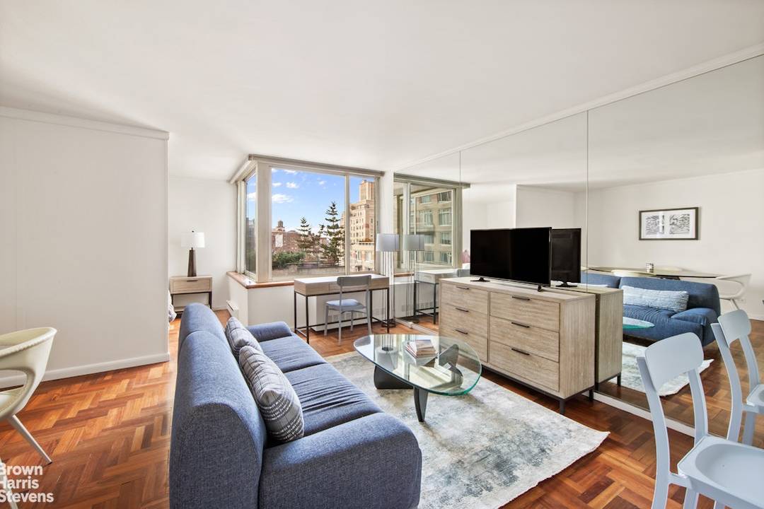 Spacious, high floor, alcove studio with separate sleeping area carved out with a pressurized wall for privacy and sleeping.