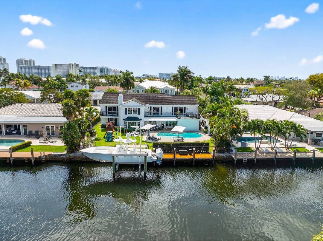 Located in the highly desirable Coral Ridge Country Club, this exceptional waterfront home offers 6 bedrooms, 4.