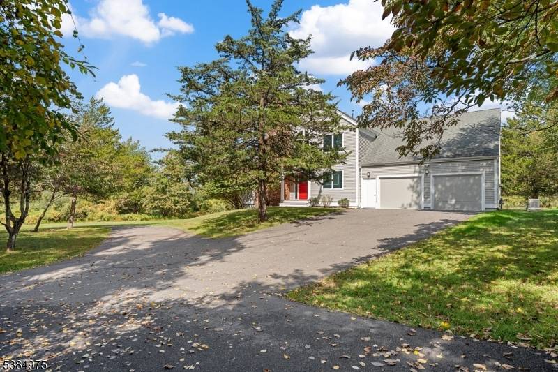 Nestled at the base of the Sourland Mountains in scenic Hillsborough, this exceptional 4 bedroom, 2.