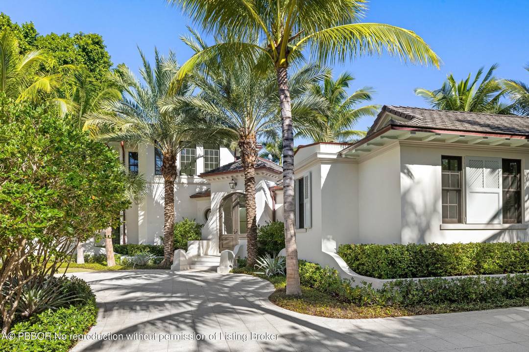Tucked away on a quiet cul de sac on one of Palm Beach's most desirable in town streets, this custom brand new residence offers privacy, scale, and refined craftsmanship.