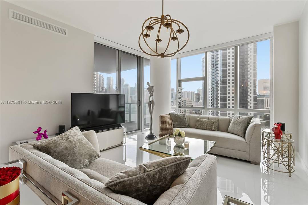 SE Corner 3 bed PLUS DEN 4 bath Residence, 10 Ft ceilings w private elevator foyer at the Miami Paramount World Center.