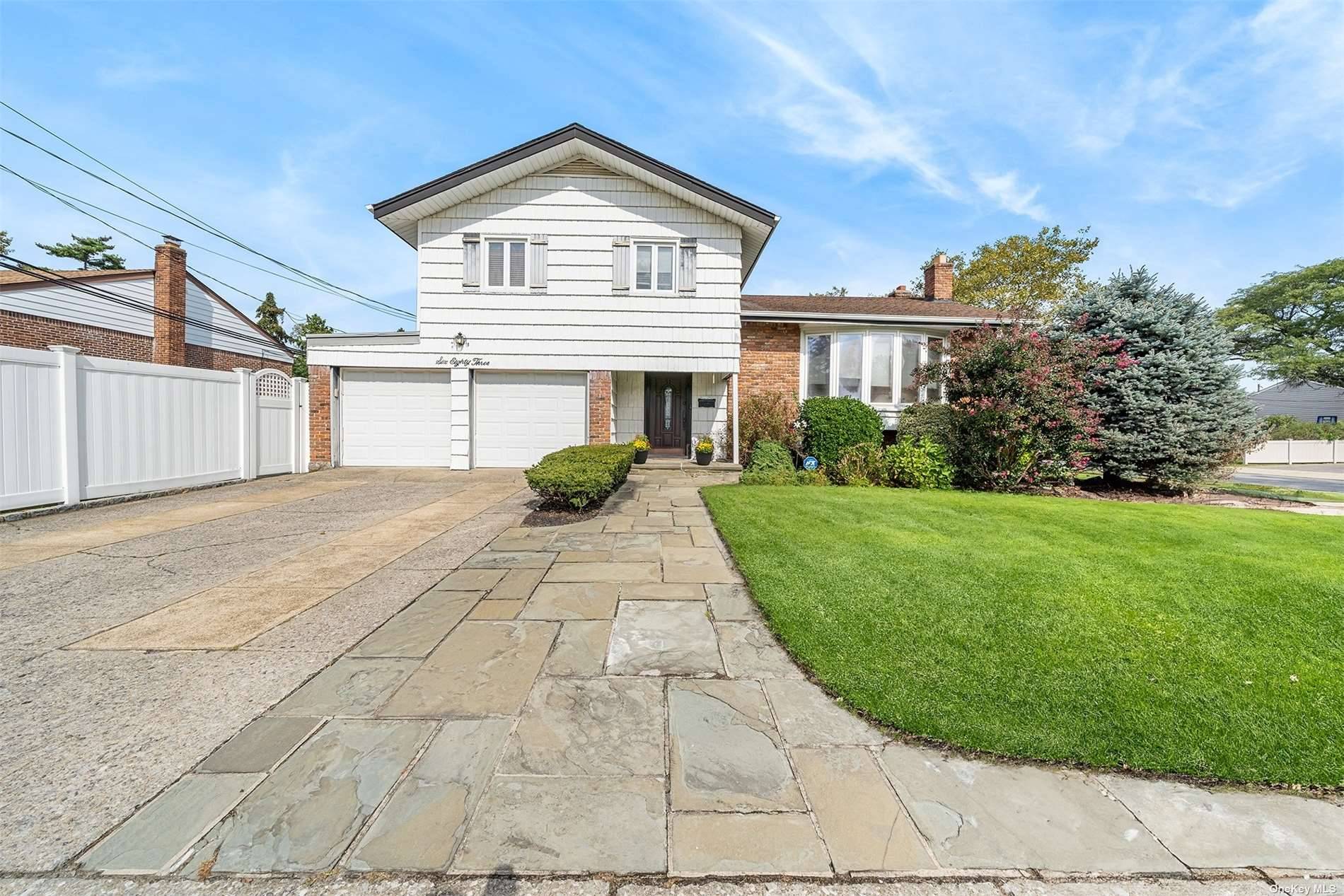 We Welcome You To This Beautifully Updated Four Level Split In The Center Of The Highly Sought After Community of North Woodmere.