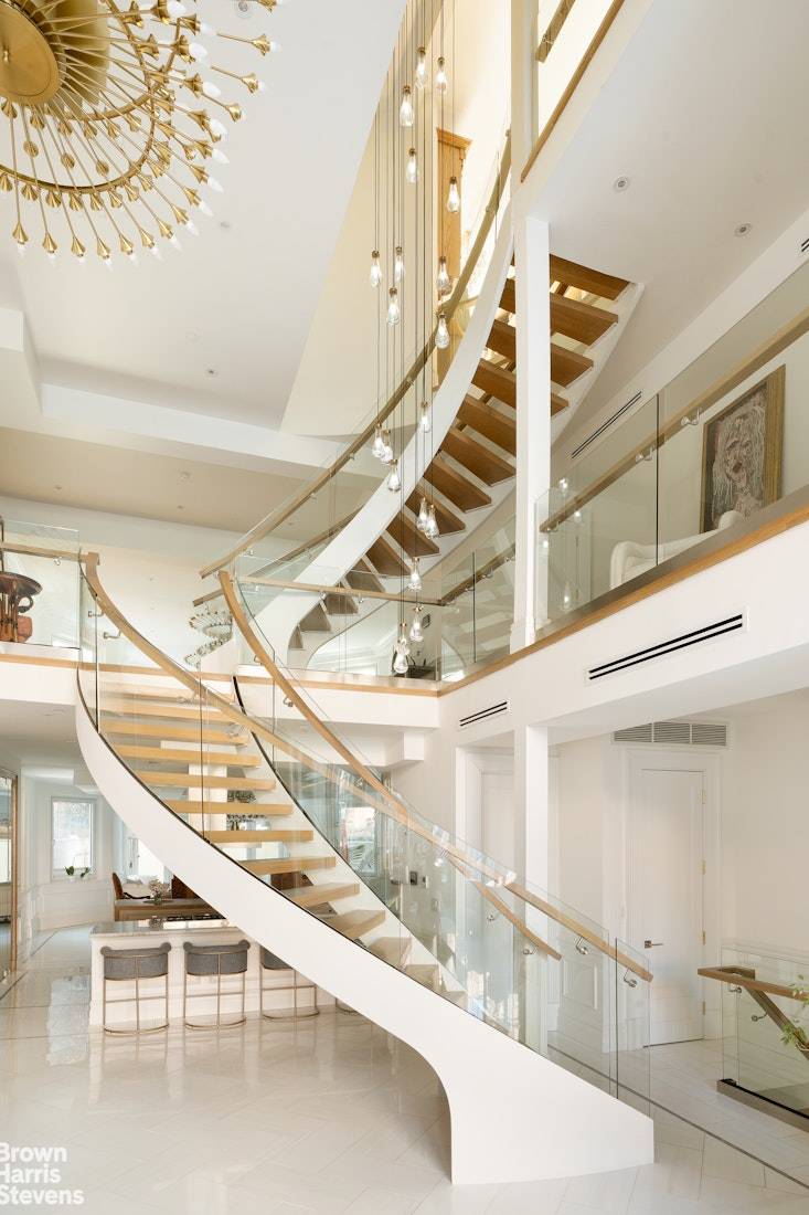This 25 foot wide elevator townhouse with 20 foot ceilings stands as a rare offering a 9, 400 square foot architectural statement masterfully reconstructed over three years to deliver uncompromising ...