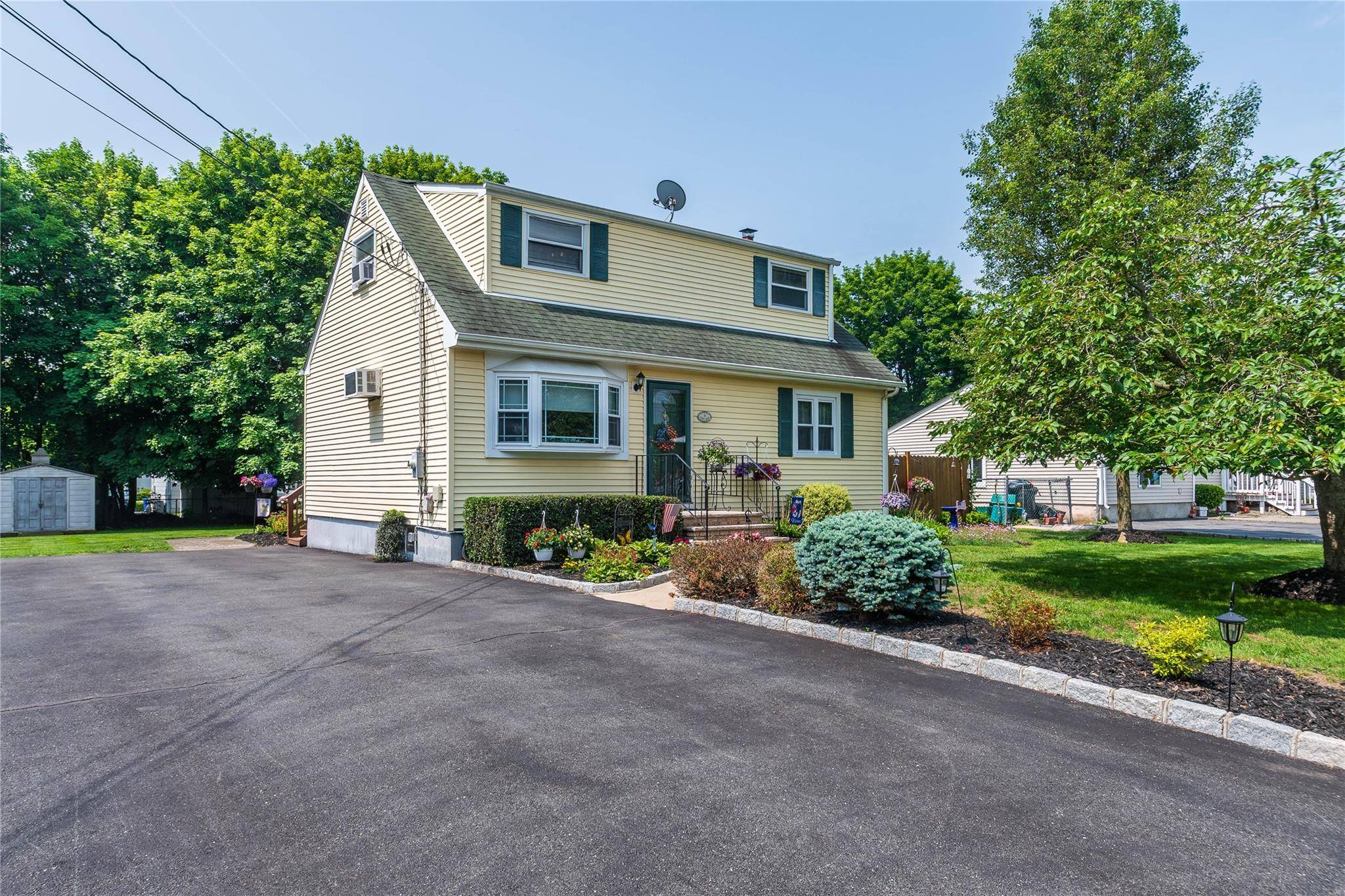 Welcome to this beautifully maintained Cape Cod style home offering 4 spacious bedrooms and 2 full bathrooms, perfect for growing families or those seeking flexible living space.