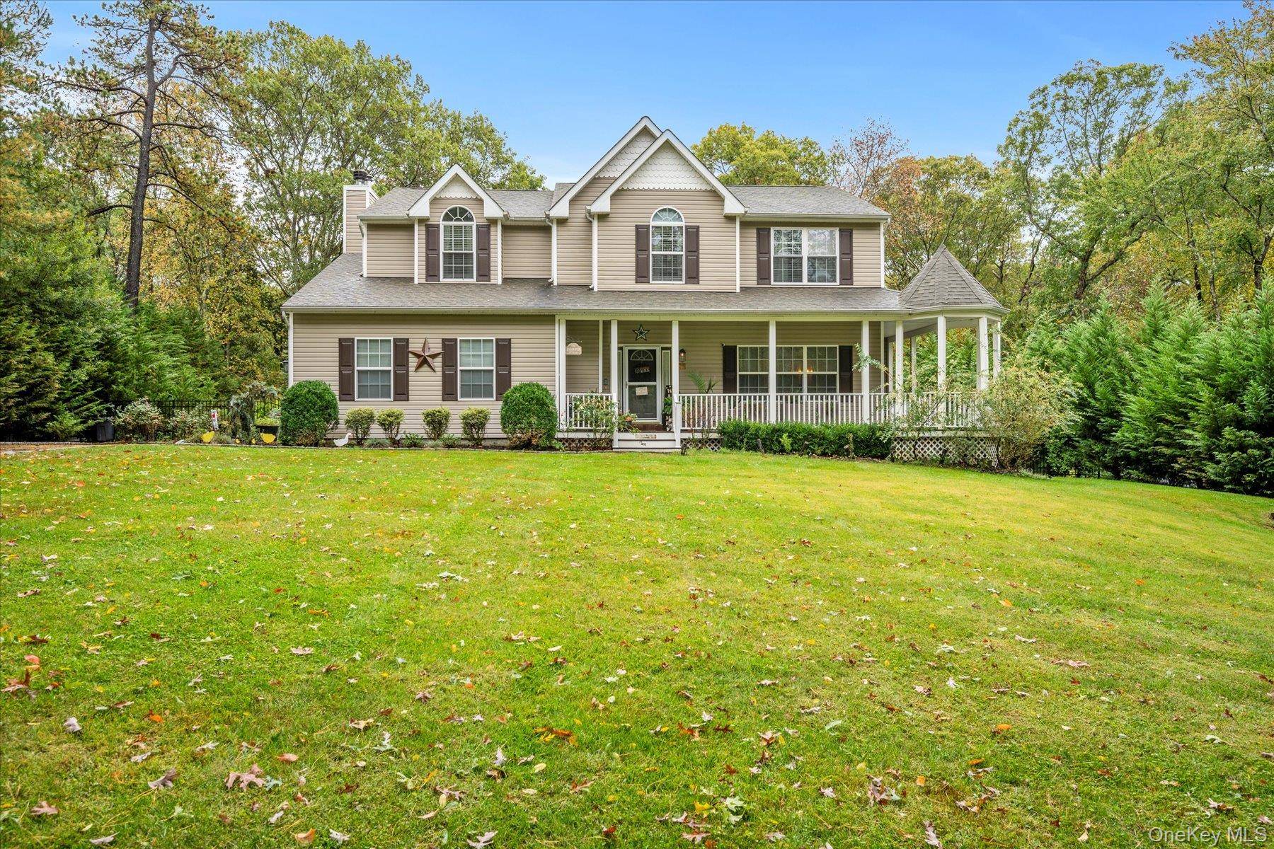 Spectacular Victorian Home with wrap around porch nestled on dead end block surrounded by state land.