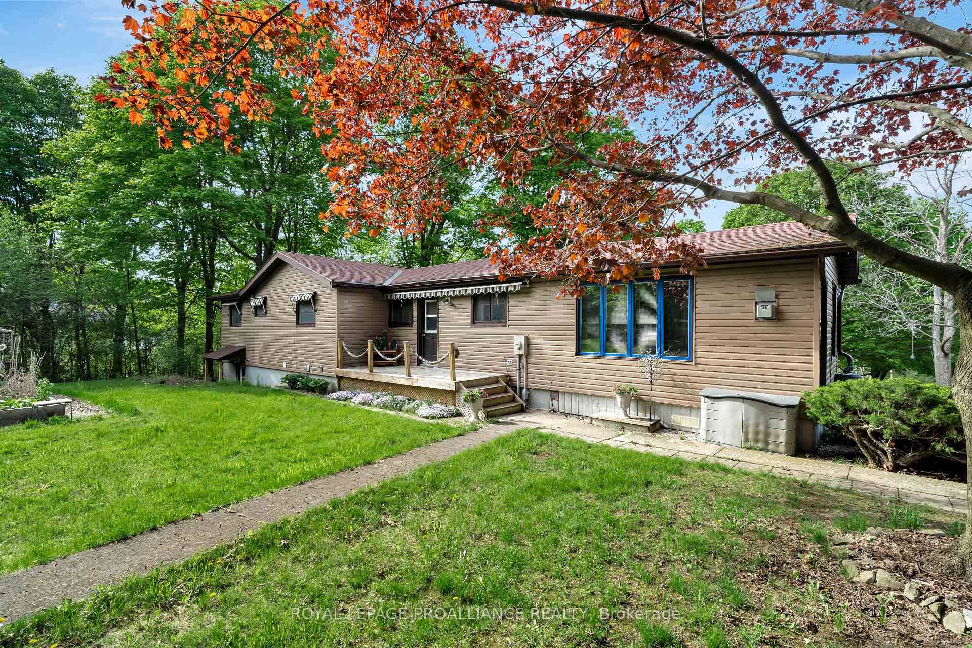 Hidden out of sight from Loyalist Parkway, this waterfront bungalow offers privacy and a great view of the lake.