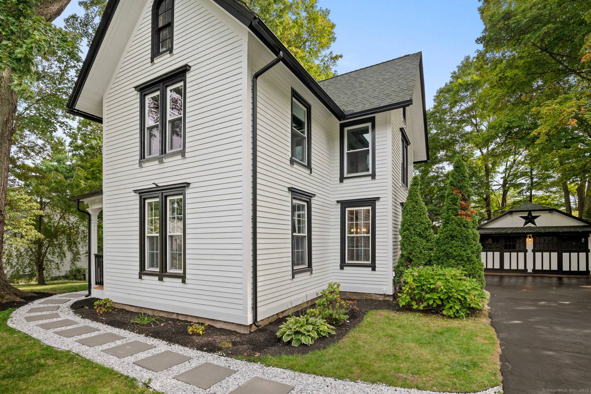 Welcome to 418 Washington Street, a beautifully remodeled New England Colonial that blends timeless charm with modern comfort.
