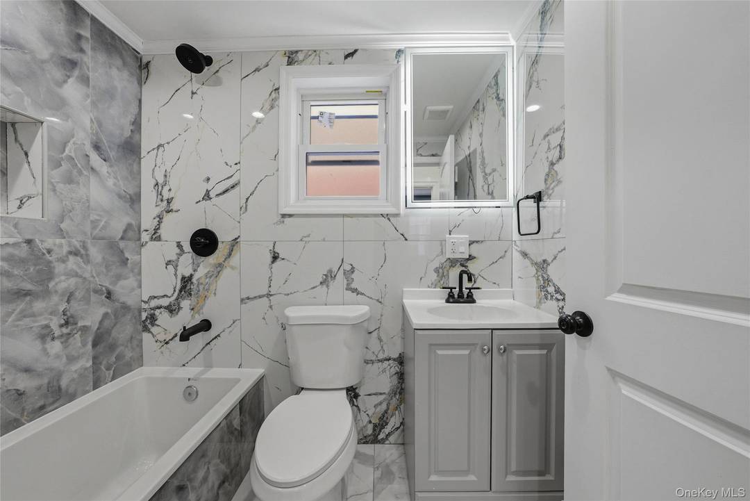 This is a conversion from a single family to a fully renovated legal 2 family.