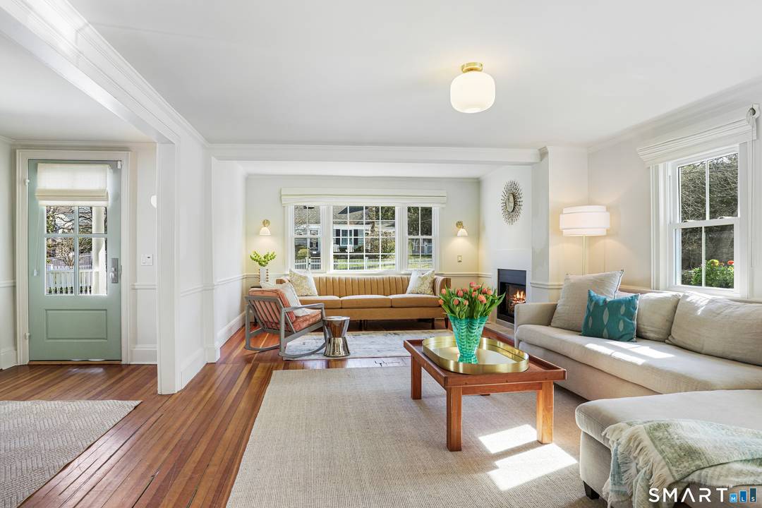 Rich in warmth and history, this enchanting antique gable front home has been thoroughly updated to offer the rare combination of timeless character and modern ease.