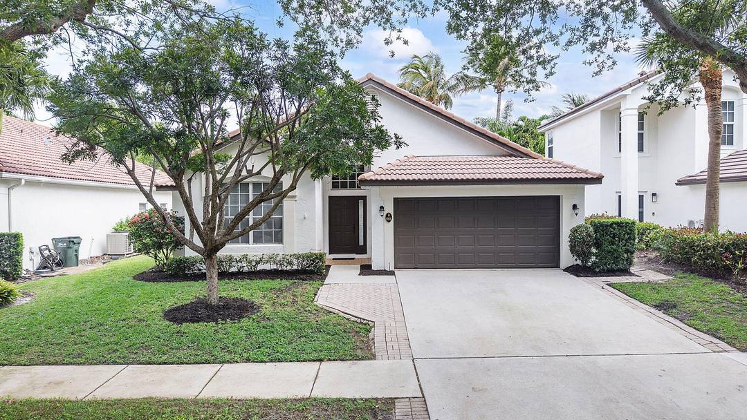 Welcome to luxury living in the highly sought after Delray Lakes community !